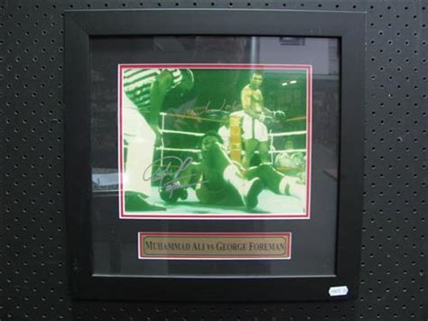 Lot - Ali vs Foreman - knockout photograph signed by both boxers