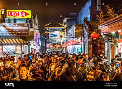 BEIJING China 23.02.2019 People crowd famous Wangfujing snack street during night in Peking ...