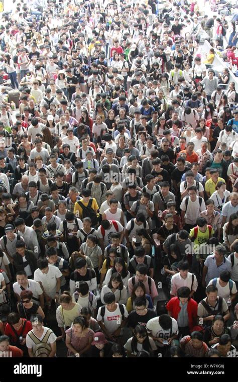 Chinese passengers crowd the Nanchang Railway Station ahead of the National Day and the Mid ...