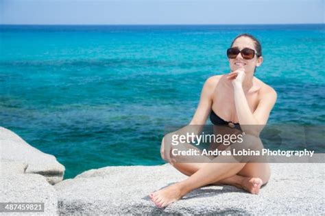 Young Woman With Sunglasses Smiling High-Res Stock Photo - Getty Images