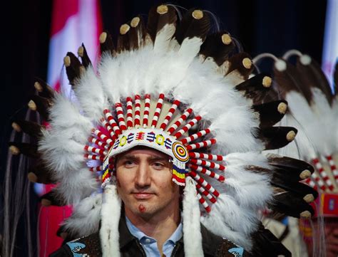 Prime Minister Justin Trudeau poses after receiving a ceremonial ...