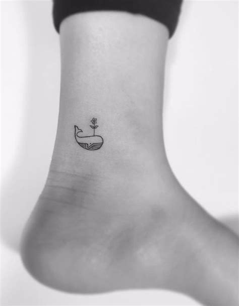 Small whale tattoo on the inner ankle - Tattoogrid.net