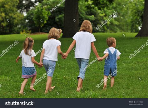 Children Holding Hands And Walking Outdoors Stock Photo 13677526 : Shutterstock