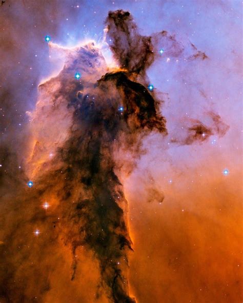 Stellar Spire in the Eagle Nebula A billowing tower of gas and dust rises from the stellar ...