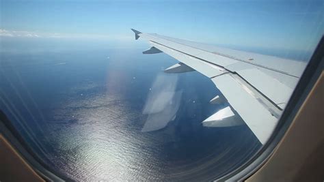 Aerial View Of Europe Out Of An Airplane Window Above The Clouds With The Earth Shaped Round ...