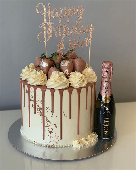 This cake screams luxury with chocolate covered strawberries piped with ...