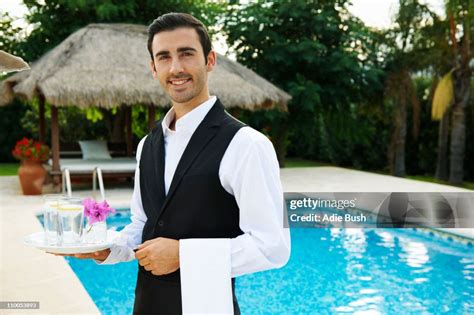 Hotel Waiter Holding Tray By Hotel Pool High-Res Stock Photo - Getty Images