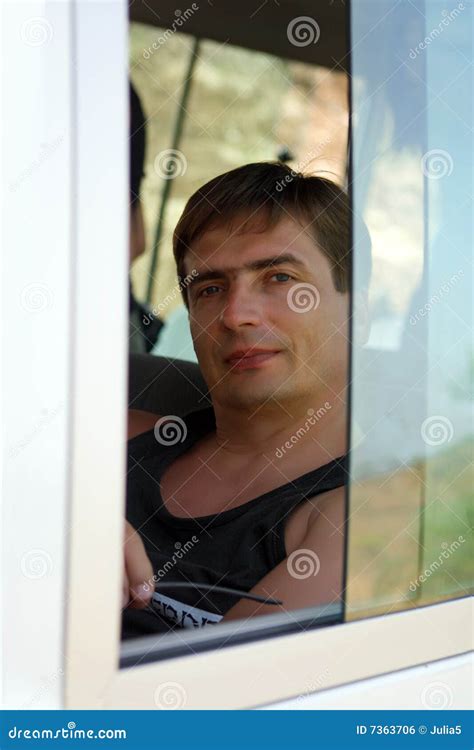 Portrait Of The Man Through The Window Of The Stock Photo - Image of tourist, land: 7363706