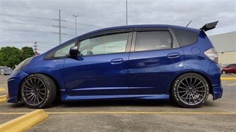 Blue Honda Fit Sport in a Parking Lot