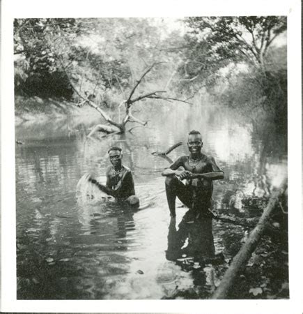 Carriers washing in Akobo river (1998.342.193.2) from the Southern ...