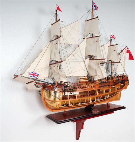 An elegant all wood wall mount display shelf. Ideal for ship models, photos, or other decorative ...