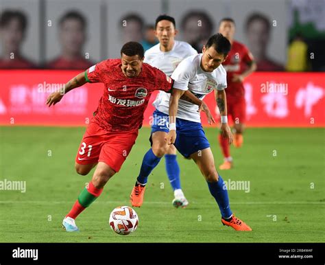 Zhengzhou, China's Henan Province. 7th July, 2023. Hildeberto Pereira (L) of Henan FC vies with ...