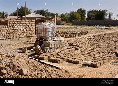 Mud bricks sun drying at residential construction site development near Shymkent Kazakhstan ...