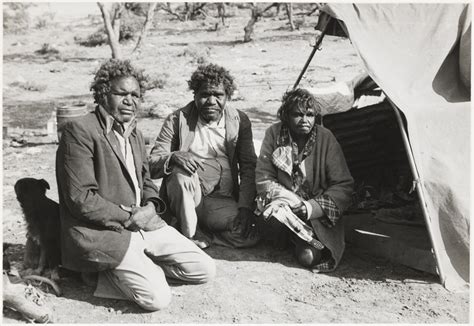 Aboriginal Australians by a humpy at fringe-dwellers' camp, possibly ...