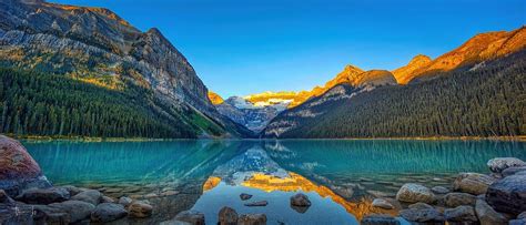 A Panoramic View of Sunrise at Lake Louise, Banff National Park, Canada ...