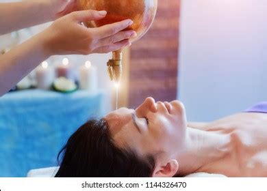 Woman Enjoying Ayurveda Oil Massage Treatment Stock Photo 1144326470 | Shutterstock