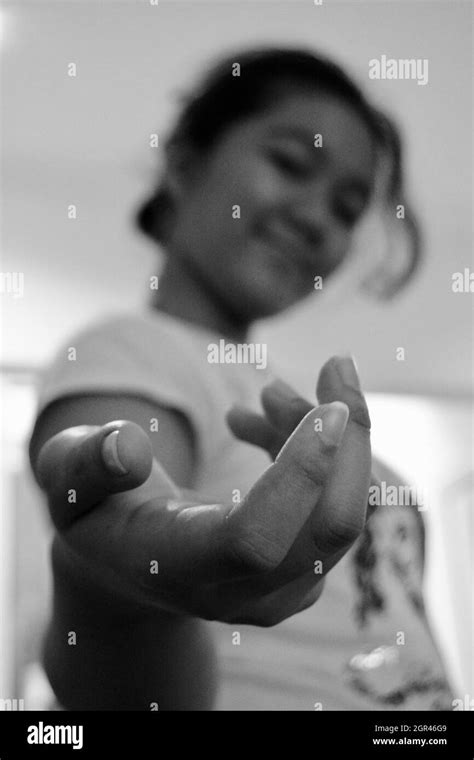 Arm reaching holding Black and White Stock Photos & Images - Alamy