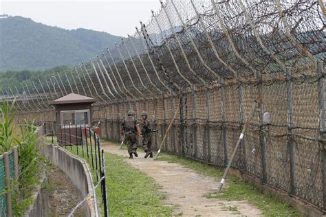 North Korean gymnast vaults 12ft barbed wire fence and sprints to freedom across world's most ...
