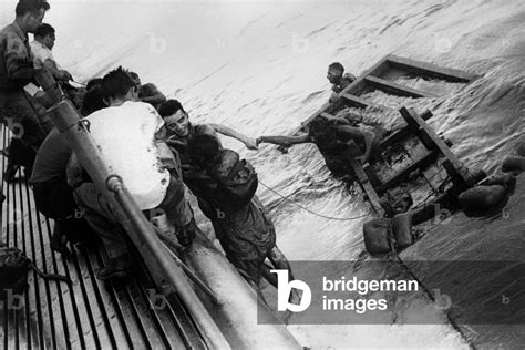 Image of USS Sealion picks up British and Australian survivors of Japanese