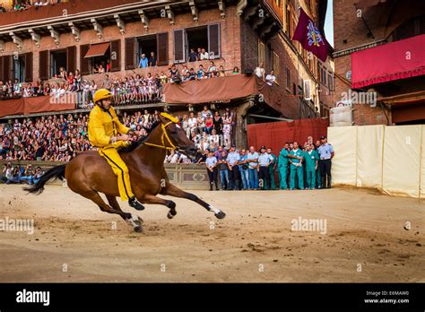 The Palio di Siena horse race on Piazza del Campo, Siena, Tuscany ...