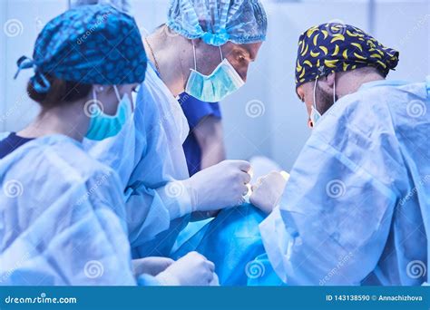 Serious Surgeons during a Surgery in the Hospital. Cross Process Stock Photo - Image of ...