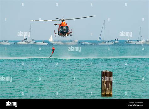 U.S. Coast Guard Helicopter & Boat Rescue / Lifting rescue swimmer out ...