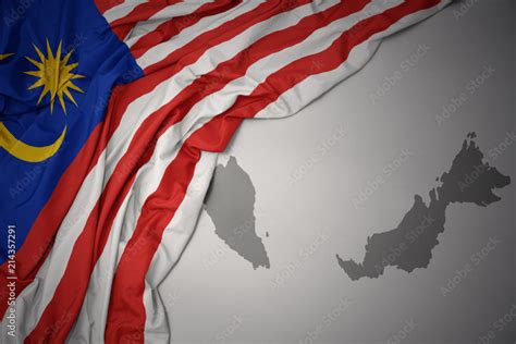 waving colorful national flag and map of malaysia. Stock Photo | Adobe Stock