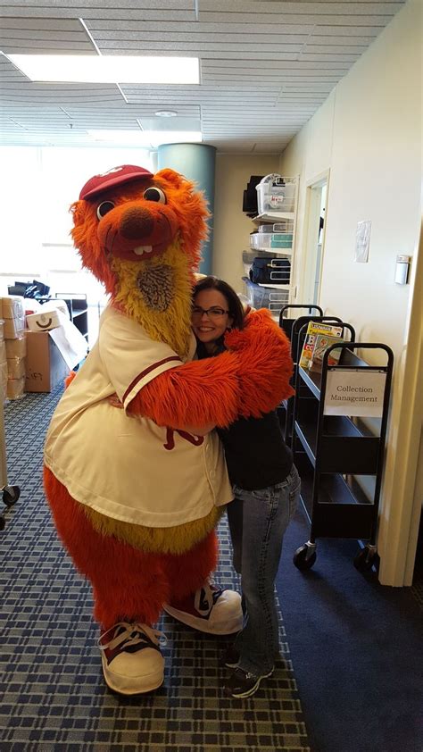 Deuce, the Frisco Roughriders mascot, hugs librarian Lori. | Frisco ...