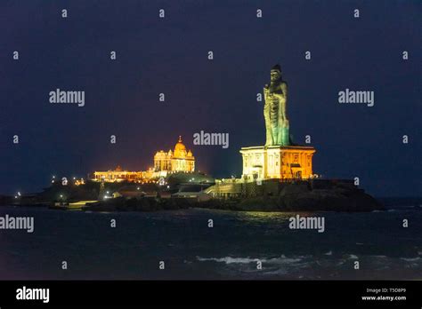 Horizontal view of the Vivekananda rock memorial and Thiruvalluvar Statue lit up at night in ...