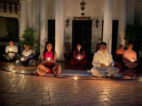 Dharmendra Pradhan lights Diya lamp with his family members to show solidarity with people in ...