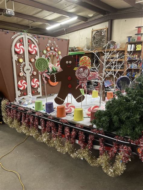 an assortment of christmas decorations on display in a storeroom with gingerbreads and candy canes