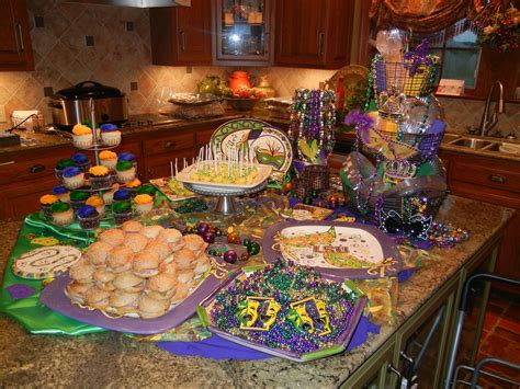 Mardi Gras engagement party. Food table. Mardi Gras platters, cupcakes ...