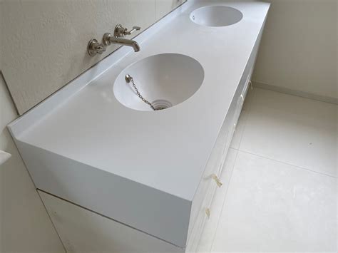 corian designer white bathroom | Crafted by Design