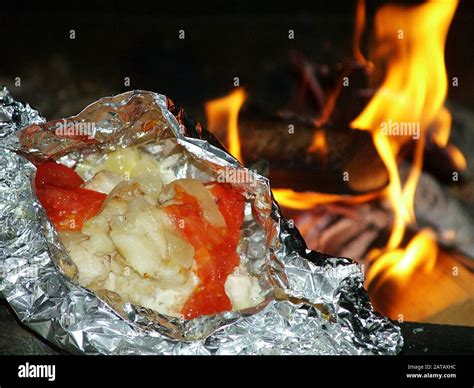 Fish in foil package Stock Photo - Alamy