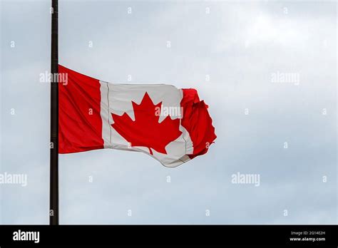 A Canadian flag at half mast, lowered in remembrance of the indigenous ...