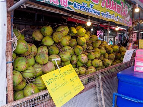 Fresh coconut, green, many fruits at coconut water shop in street ...