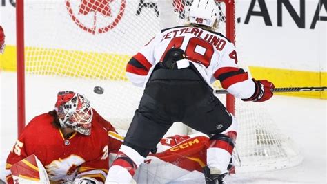 Devils extend winning streak to 6 games with overtime victory over Flames | CBC Sports