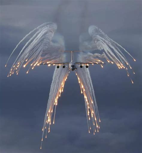 A C-130 Hercules deploying flares, sometimes referred to as Angel Flares due to the ...