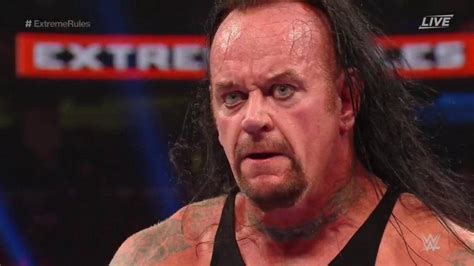 Undertaker's 4 Tattoos & Their Meanings - Body Art Guru