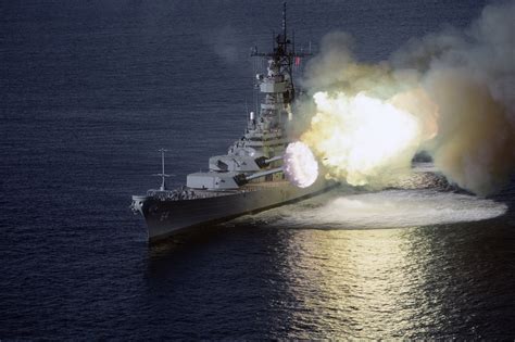 A perfectly-timed photo of the battleship USS Wisconsin firing her her 16-inch guns. That ...