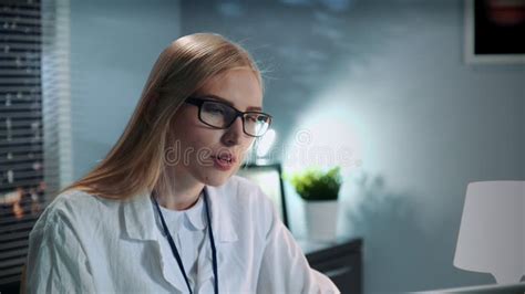 Close-up of Female Psychologist in Eyeglasses and Lab Coat Making Video Call with Patient Stock ...