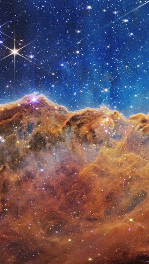 Download wallpaper: Cosmic Cliffs in the Carina Nebula 1080x1920