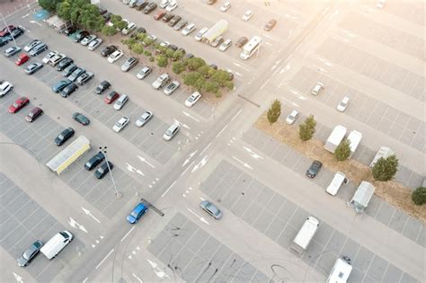 Premium Photo | Aerial view of a parking lot near a mall