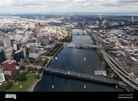 Aerial view of the Williamette River, bridges, buildings and streets in downtown Portland ...