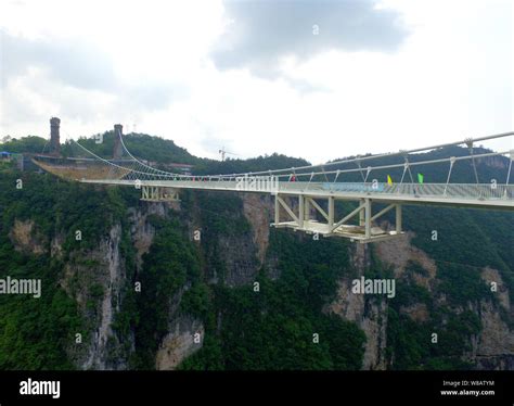 View of the world's longest and highest glass-bottomed bridge over the Zhangjiajie Grand Canyon ...