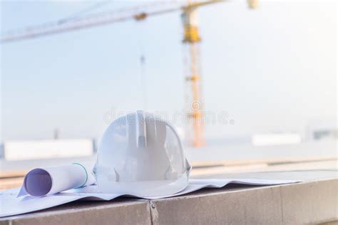 The White Safety Helmet and the Blueprint at Construction Site W. Stock Photo - Image of ...