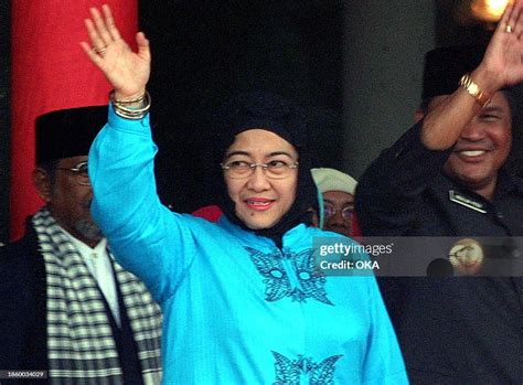 Indonesian President Megawati Sukarnoputri, in Muslim outfit, waves... News Photo - Getty Images