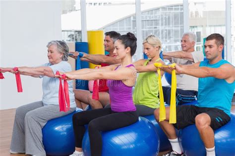 People Exercising with Resistance Bands in Gym Stock Photo - Image of mature, length: 49893672