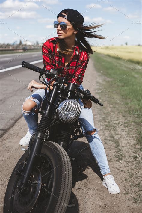 Biker girl sitting on motorcycle | High-Quality People Images ...