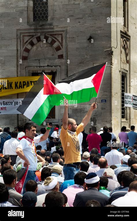 Man holding palestinian flags during protest at Istanbul Stock Photo ...